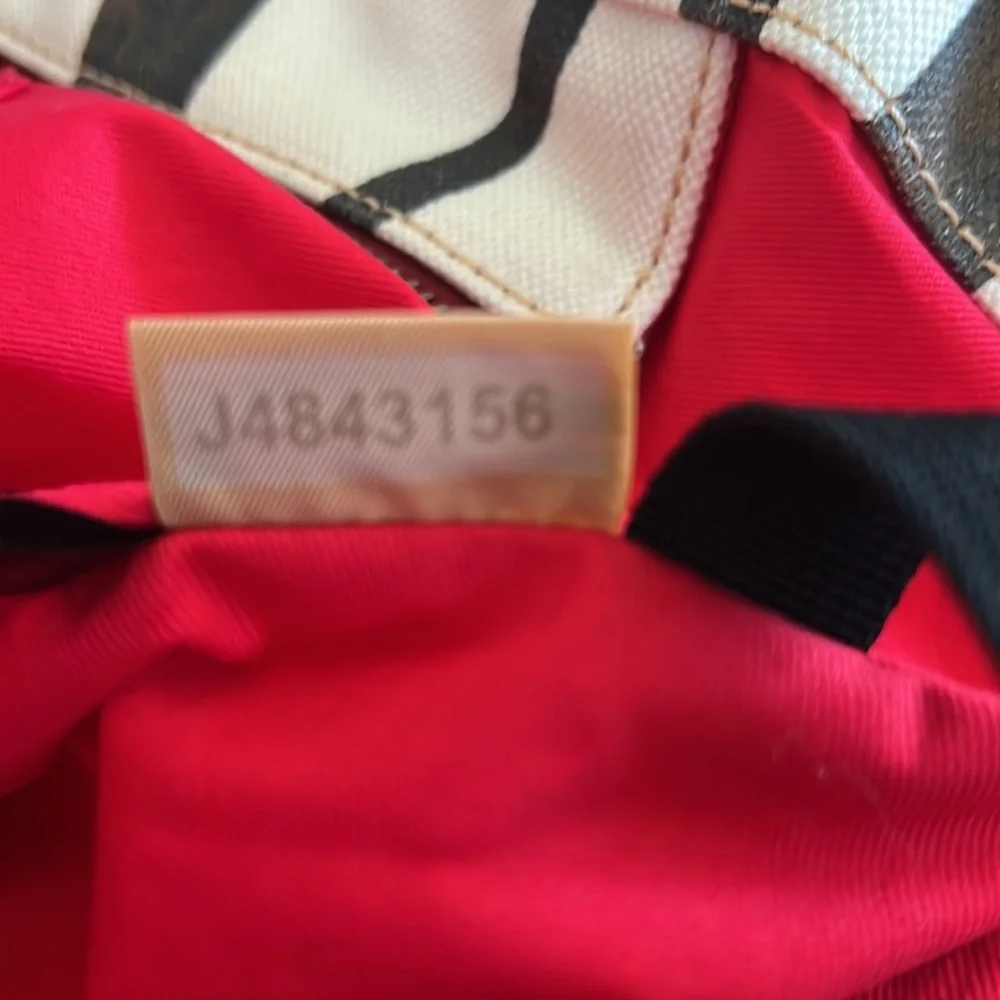 Dooney & Bourke Zebra Print Tote with Red Accents
In pristine condition. - Picture 7 of 8